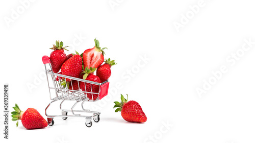 Fresh strawberries in shopping cart