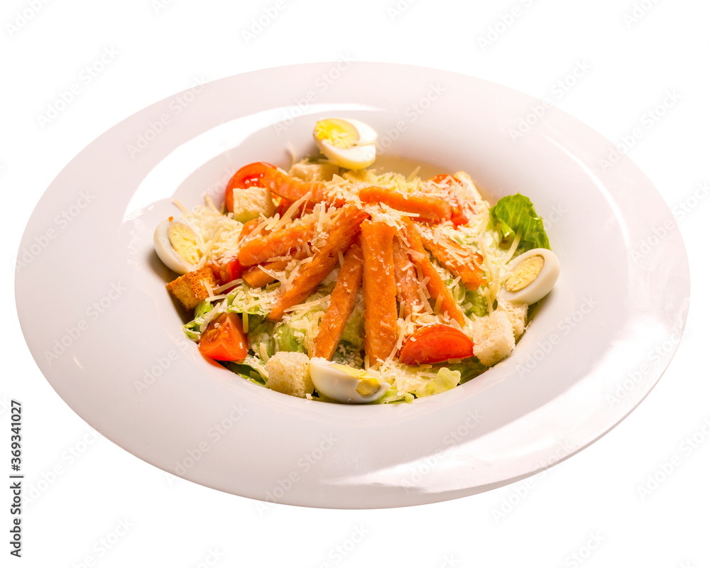 Caesar salad with grilled salmon, Isolated image on a white background.