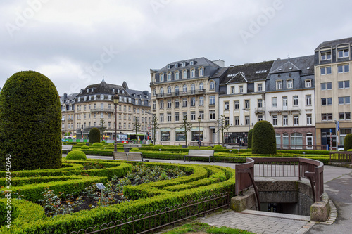 City street with green Park and underground passage