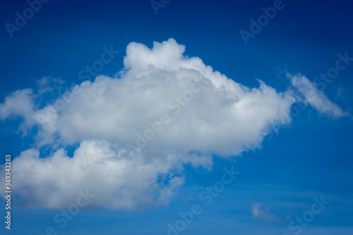 White clouds in blue sky background.