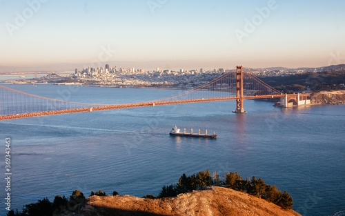 Konstfotografi Golden Gate Bridge with Cargo Ship