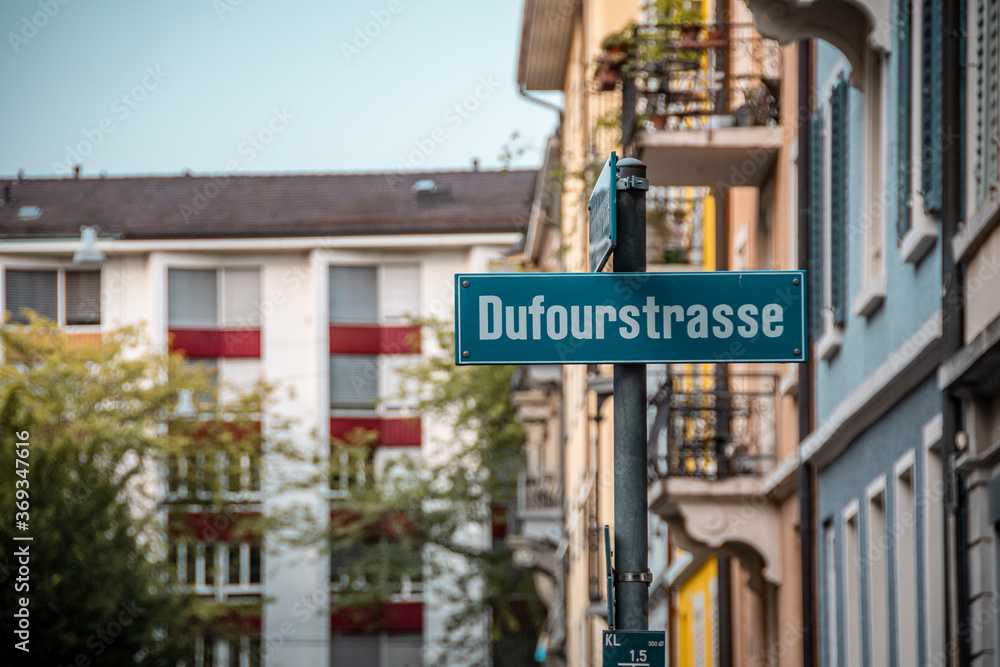 Fototapeta premium Green street sign. Signpost with street name in German. European city.
