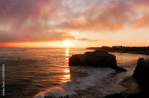 Sunset over Natural Bridges State Beach. The last remaining Natural Bridge in Santa Cruz, California.