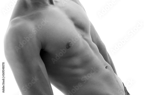 Shirtless young man isolated on white. Black and white