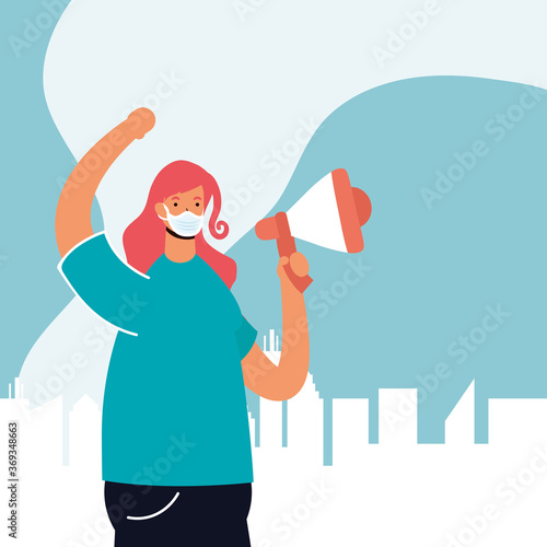 woman wearing medical mask protesting with megaphone