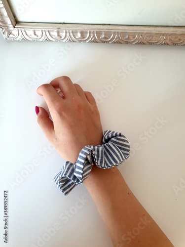 scrunchie hair band on the hand
