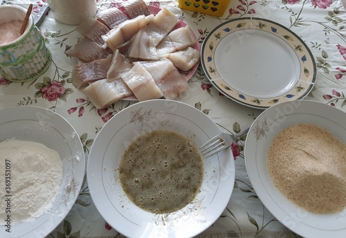 preparing breadcrumbs fish for dinner