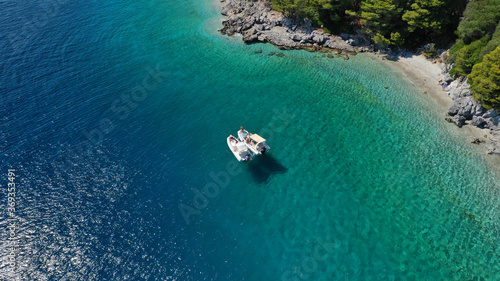 Aerial drone photo of beautiful tranquil turquoise beach of Antrines near famous Panormos beach, Skopelos island, Sporades, Greece photo