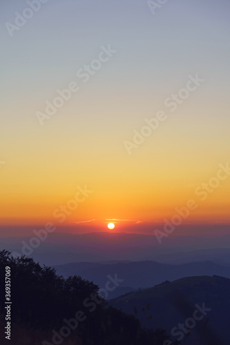 Mountain landscape in sunrise or sunset - Foggy image of hills covered with forest and sky - freedom nature tourist destination concept - stara planina Old Mountain in Serbia