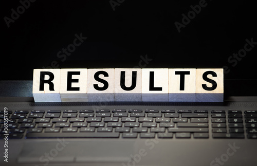 Results - words from wooden blocks with letters, result concept, top view background