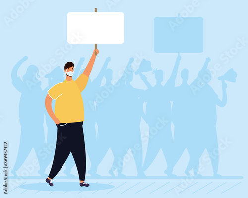 man wearing medical mask protesting with placard