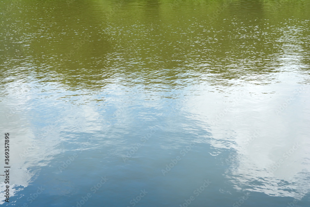 Fototapeta premium Water surface with reflections. Lake landscape.