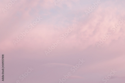 soft pastel pink evening sky with couds
