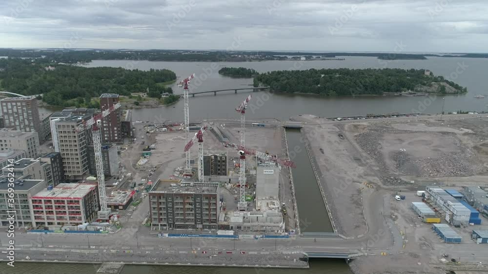building construction site with water views on a cloudy day. Drone shot. building construction site with water views on a cloudy day. Drone shot.