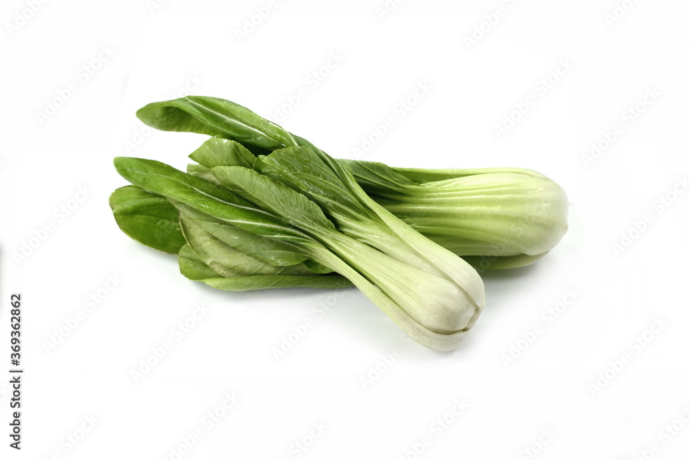 Fresh pak choi cabbage or chinese cabbage, isolated on white background. Fresh, green vegetable, close-up shot. Healthy lifestyle theme, kitchen scene. Fresh pak choi cabbage or chinese cabbage, isolated on white background. Fresh, green vegetable, close-up shot. Healthy lifestyle theme, kitchen scene.