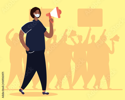 afro man wearing medical mask protesting with megaphone