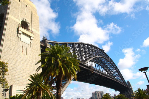 Close-up Sydney Harbour Bridge with City Skyline, with a cloudy sky, Sydney, New South Walls, Australia © Sabrina