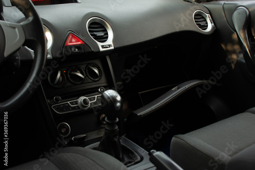top view of the dashboard and interior of a car with the glove box open