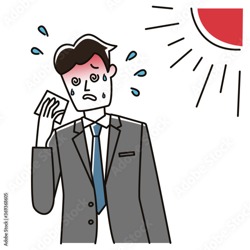 熱中症で倒れそうな会社員