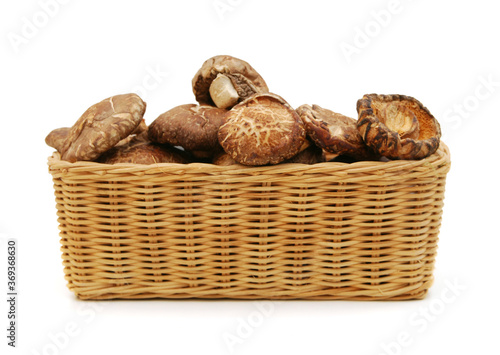 Dried mushrooms isolated in basket on a white background