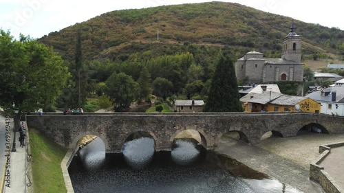 Camino de Santiago. Bridge of pilgrims in Molinaseca. Village in El Bierzo. Leon,Spain Aerial Drone Footage.  photo