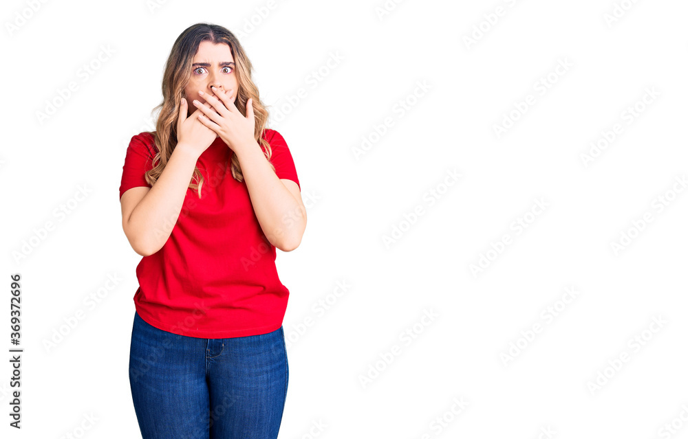 Young caucasian woman wearing casual clothes shocked covering mouth with hands for mistake. secret concept. Young caucasian woman wearing casual clothes shocked covering mouth with hands for mistake. secret concept.