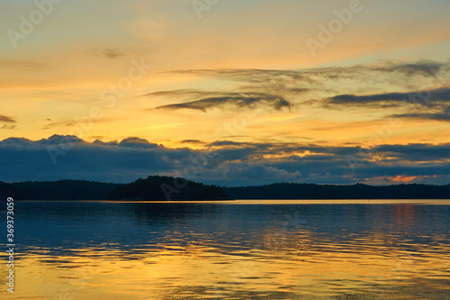 A colofrul sunset with reflections on water in an archipelago in Parainen  Finland.