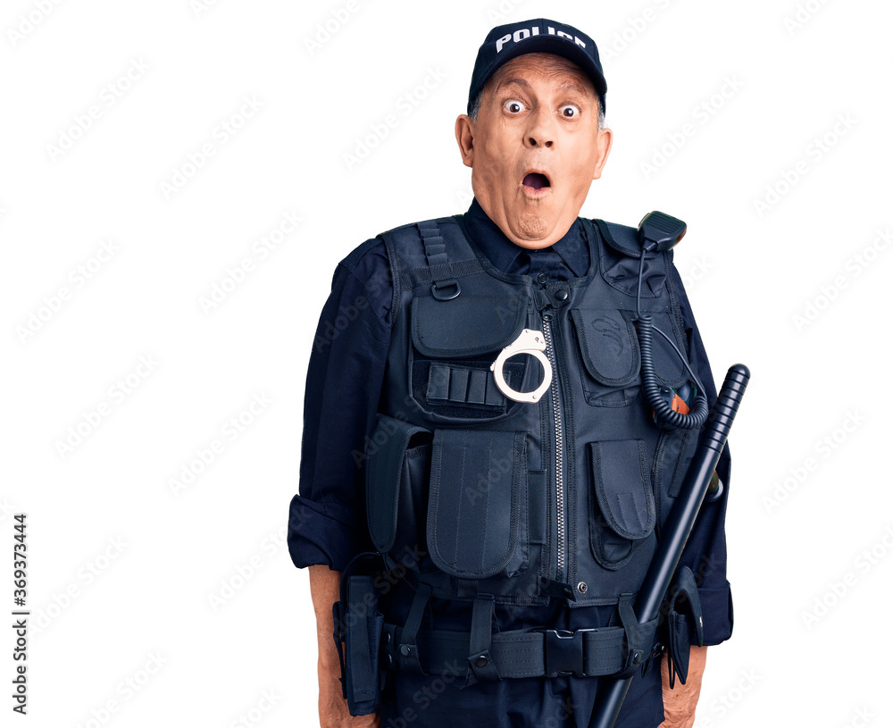 Senior handsome man wearing police uniform scared and amazed with open mouth for surprise, disbelief face Senior handsome man wearing police uniform scared and amazed with open mouth for surprise, disbelief face