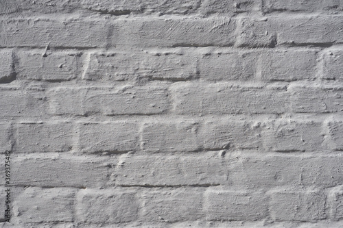 White rare painted brik wall background texture.