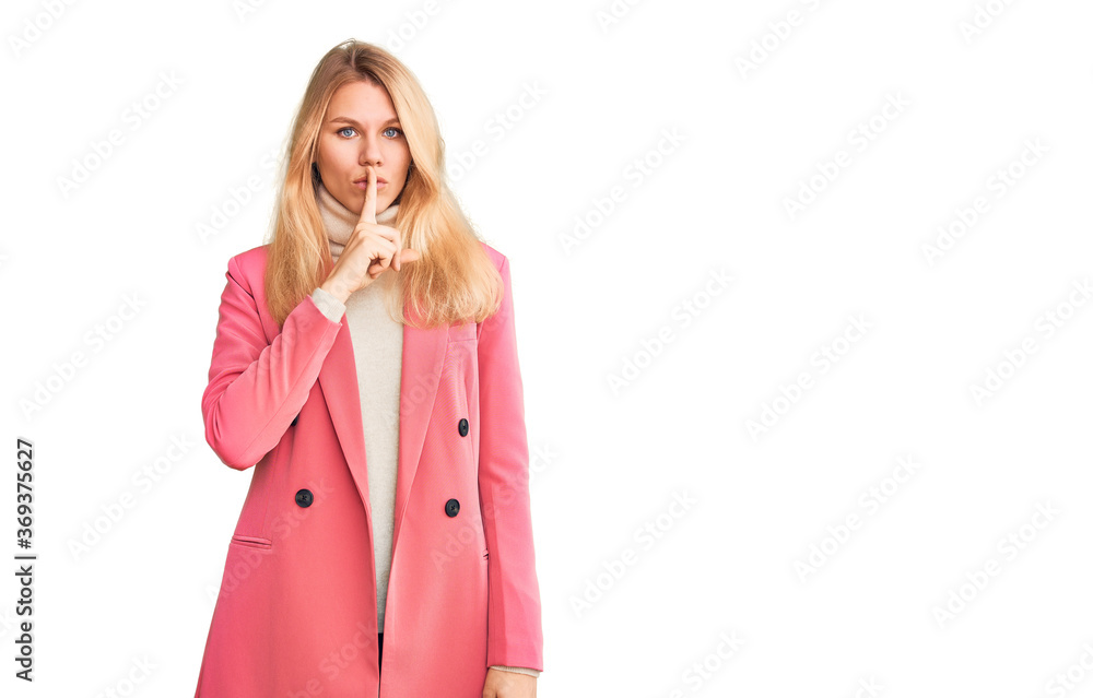 Young beautiful blonde woman wearing elegant clothes asking to be quiet with finger on lips. silence and secret concept. Young beautiful blonde woman wearing elegant clothes asking to be quiet with finger on lips. silence and secret concept.