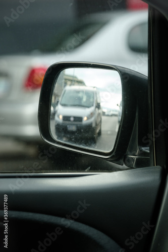 rear view mirror of car driving in motion