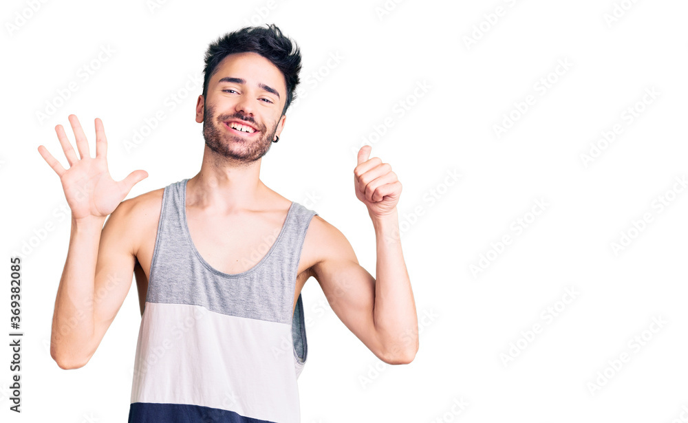 Young hispanic man wearing casual clothes showing and pointing up with fingers number six while smiling confident and happy. Young hispanic man wearing casual clothes showing and pointing up with fingers number six while smiling confident and happy.