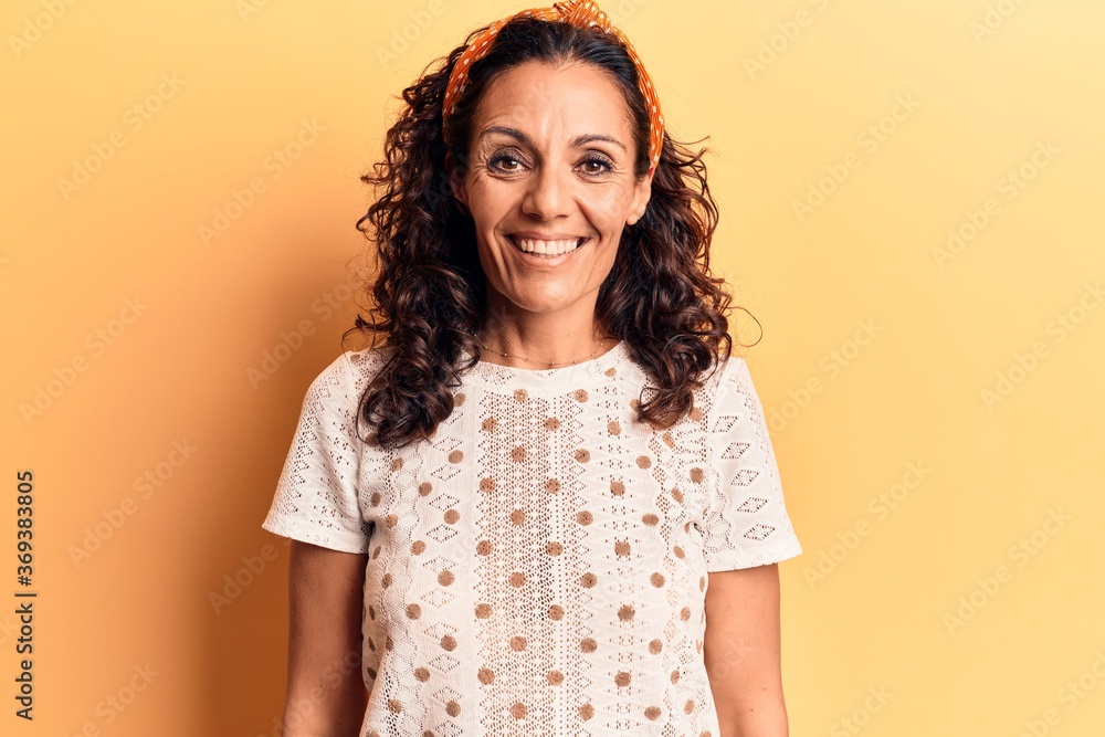 Middle age beautiful woman wearing casual t shirt with a happy and cool smile on face. lucky person. Middle age beautiful woman wearing casual t shirt with a happy and cool smile on face. lucky person.
