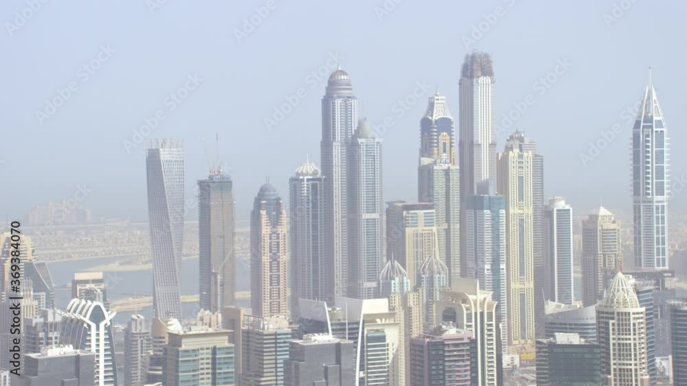 Amazing aerial shot of the Dubai Marina skyline and Atlantis the Palm Hotel in the background, pan left and zoom in, 6-axis stabilized gimbal, Shotover F1, 8K, parallax. Amazing aerial shot of the Dubai Marina skyline and Atlantis the Palm Hotel in the background, pan left and zoom in, 6-axis stabilized gimbal, Shotover F1, 8K, parallax.