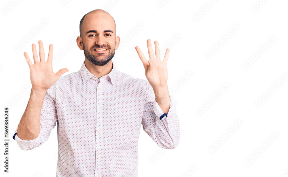 Naklejka premium Young handsome man wearing elegant shirt showing and pointing up with fingers number nine while smiling confident and happy.