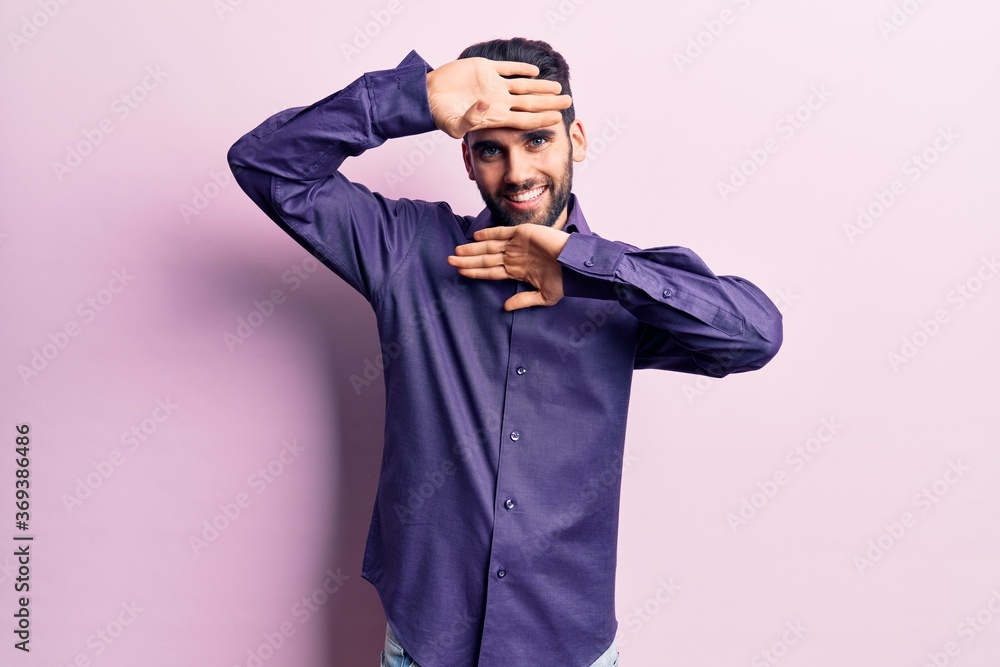 Young handsome man with beard wearing casual shirt smiling cheerful playing peek a boo with hands showing face. surprised and exited Young handsome man with beard wearing casual shirt smiling cheerful playing peek a boo with hands showing face. surprised and exited
