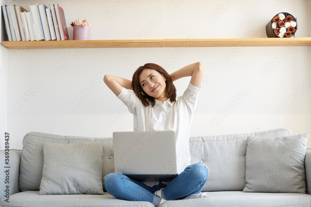 young asian businesswoman working at home using laptop young asian businesswoman working at home using laptop