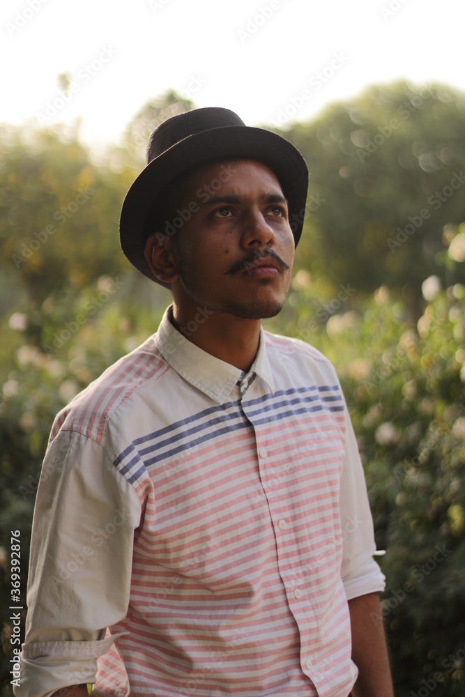 young man wearing black hat and thinking deep young man wearing black hat and thinking deep