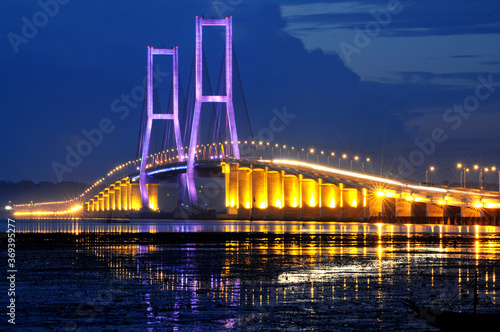 Beautiful scenery before the sun sets on the Suramadu bridge connecting Java Island and Madura Island in Surabaya, East Java, Indonesia
