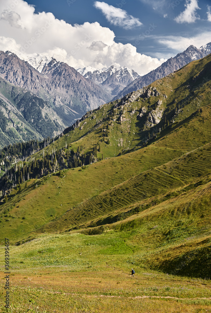 Small Hiker in the high mountains Small Hiker in the high mountains