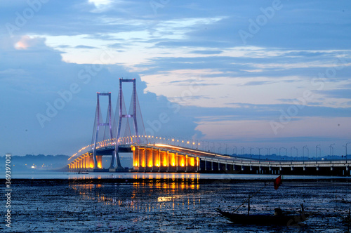 Beautiful scenery before the sun sets on the Suramadu bridge connecting Java Island and Madura Island in Surabaya, East Java, Indonesia
