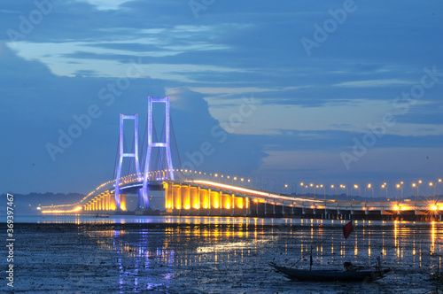 Beautiful scenery before the sun sets on the Suramadu bridge connecting Java Island and Madura Island in Surabaya, East Java, Indonesia
