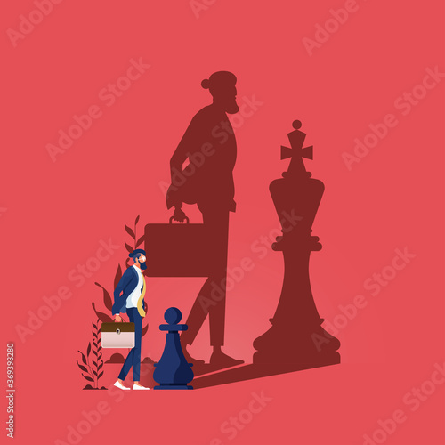 Dream big-Businessman standing with the shadow of a chess king, Chess pawn with king shadow. Ambitious, successful and big dream concept