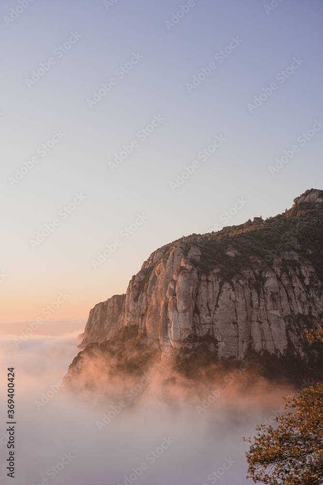 sunrise on a mountain above the clouds