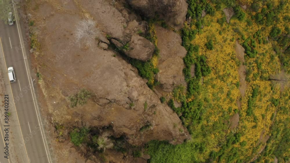 Top down aerial of Butte Creek Lookout, flying over road, rocky mountain range Top down aerial of Butte Creek Lookout, flying over road, rocky mountain range