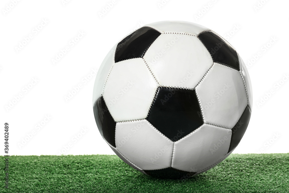 Obraz premium Soccer ball on green field against white background