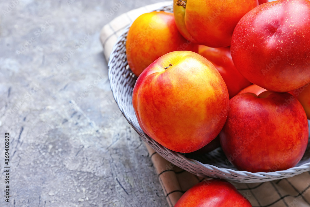 Plate with sweet ripe nectarines on table Plate with sweet ripe nectarines on table