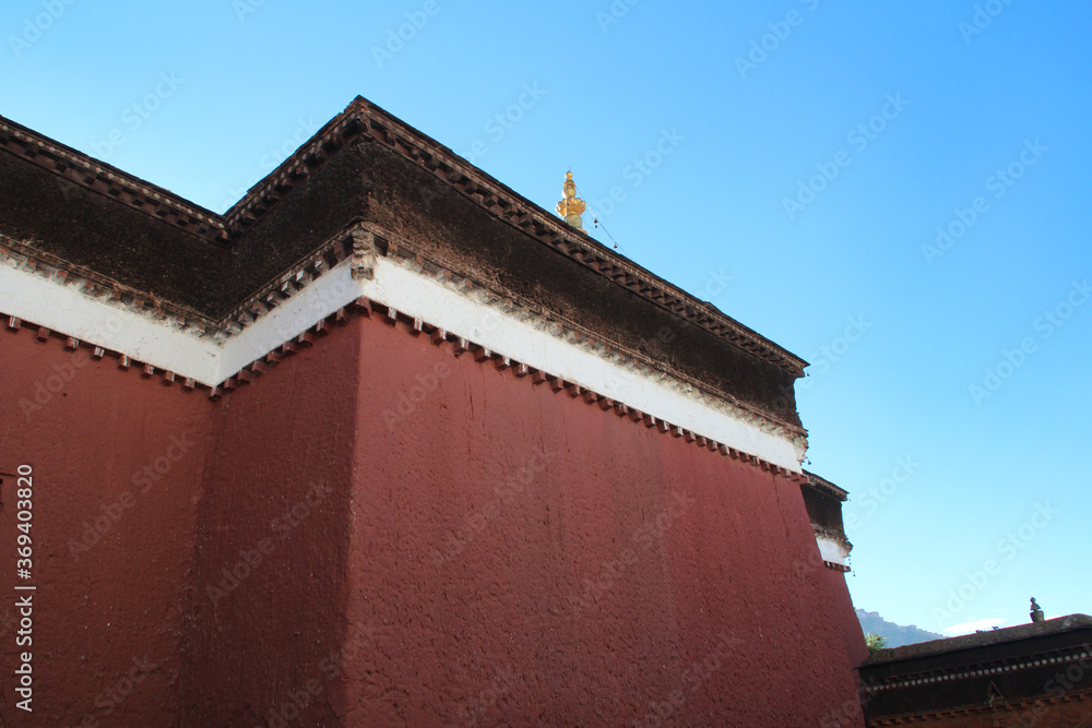 Red wall of Palcho Monastery in a sunny morning, Gyantse, Tibet