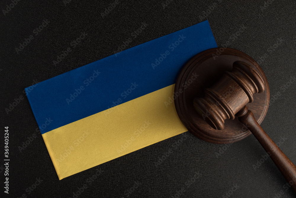 Judge Gavel and flag of Ukraine. Law and justice in Ukraine. Violation of rights and freedoms Judge Gavel and flag of Ukraine. Law and justice in Ukraine. Violation of rights and freedoms