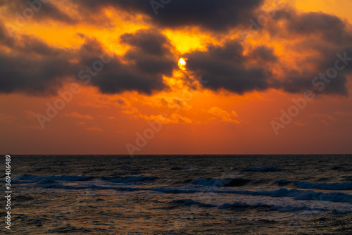 Sun in the clouds over the sea © Vastram